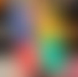 Hand holding the book "Lessons in Chemistry" by Bonnie Garmus against a bookshelf. Cover features a vintage TV illustration and vibrant colors.