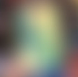 A hand holds "This Happened to Me" by Kate Price. The book has a green cover with a forest scene. Bookshelves blur in the background.