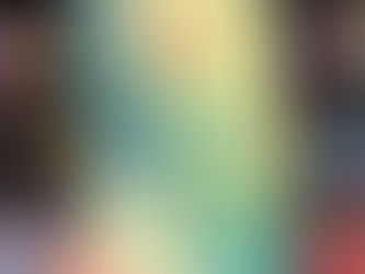 A hand holds "This Happened to Me" by Kate Price. The book has a green cover with a forest scene. Bookshelves blur in the background.