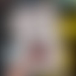 Close-up of a hand holding the book "The Imposter Phenomenon" by Dr. Kate Atkin, in front of a blurred bookshelf. The cover features a masked figure.