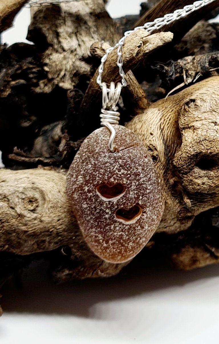 Thumbnail: Double Hearts Carved Brown Sea Glass Necklace