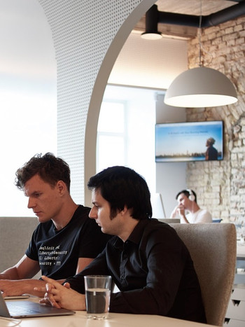 Wix employees working together at the Wix Vilnius office