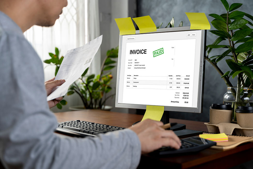Person on a computer that shows a paid invoice