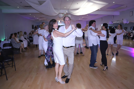 People dancing together at the 2nd Anniversary Party at DanceWise Dance Studio in Phoenix, Arizona