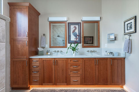 To support the evolving needs of a retired couple, this primary and guest bathroom renovation focused on long-term independence and refined aesthetics. The original tub was replaced with a spacious walk-in shower featuring a built-in bench and strategically placed grab bars. Enhanced storage through a new linen cabinet and updated, durable materials ensure these spaces remain functional and elegant for years to come.