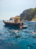 an FTLO travel group swimming in Amalfi