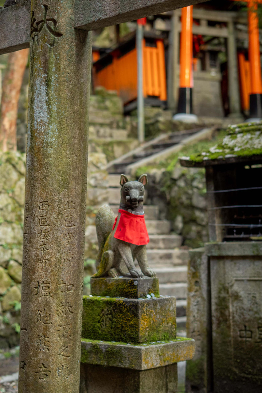 Stone fox statue at Fushimi Inari Shrine in Kyoto, Japan.