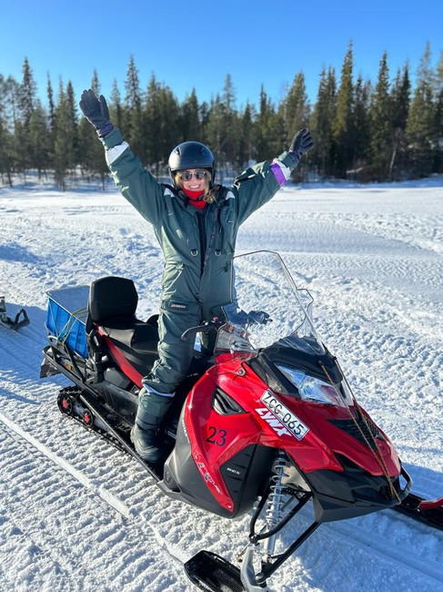 Traveler on a snowmobile in Lapland