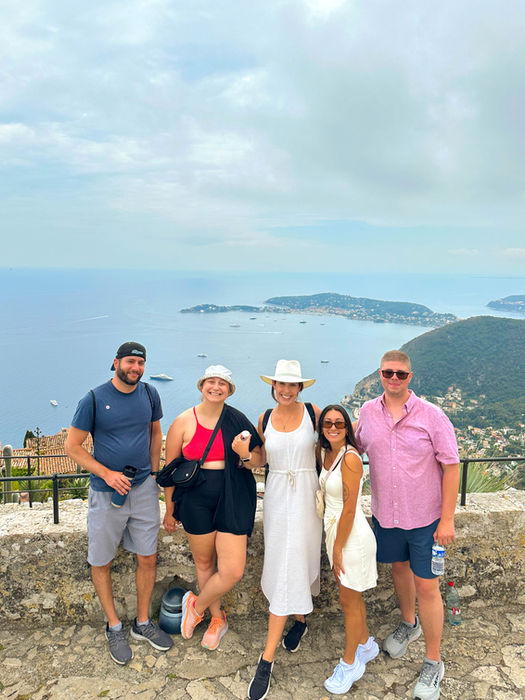 FTLO Barcelona travel group with a view of the the water in the background