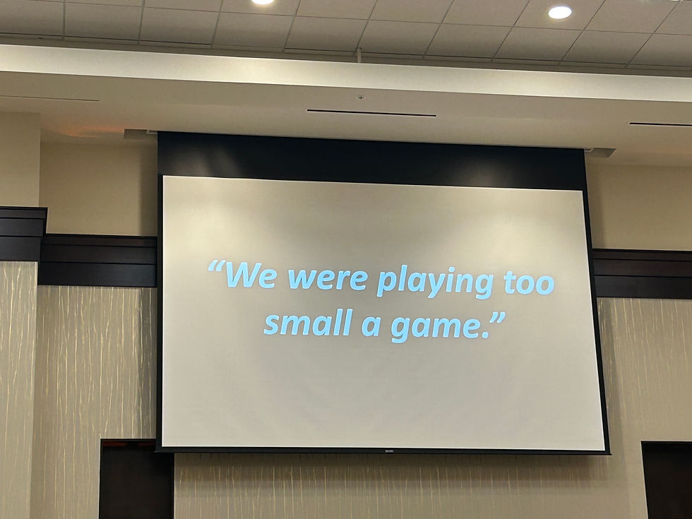 Presentation slide at the Kansas Entrepreneurship & Youth Summit displaying the quote, “We were playing too small a game.”