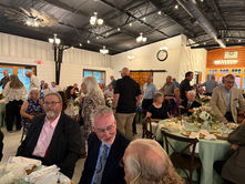 Donors, volunteers, nonprofit leaders and community partners gather around decorated tables during the Community Foundation of Dickinson County’s annual meeting.