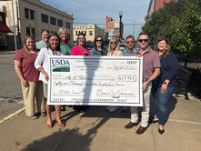 City of Abilene, Driving Dickinson County and community representatives pose with an $89,787 USDA Rural Business Development Grant check for the Rural Business Accelerator Program.