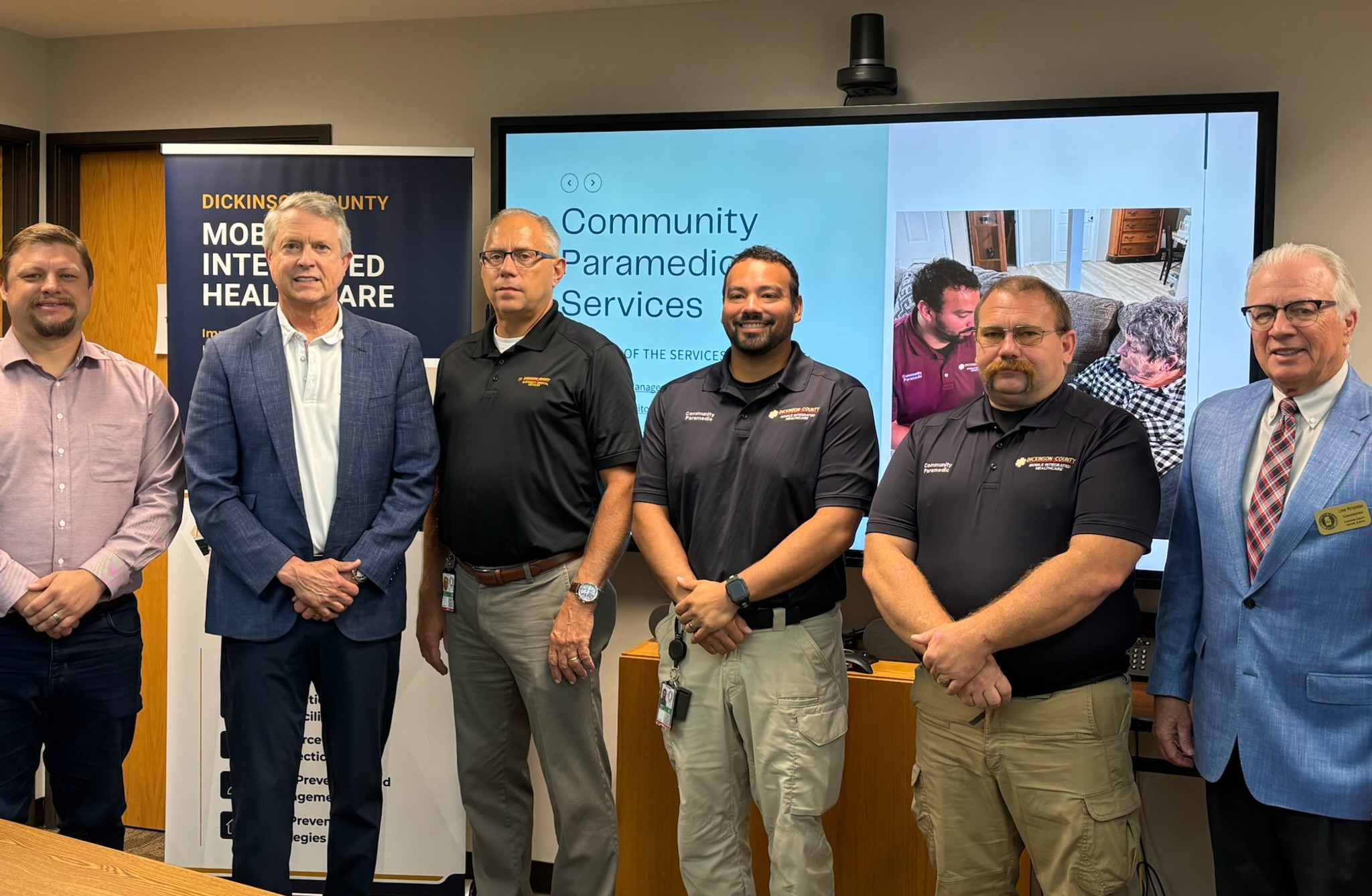 U.S. Sen. Roger Marshall with Dickinson County commissioners, EMS and Public Health Director John Hultgren, and community paramedics during an Aug. 11 visit about the Mobile Integrated Healthcare program.