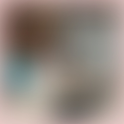 Woman working on laptop with dog on her lap