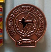 Hope McCormack’s Junior Master Bowman archery classification badge.