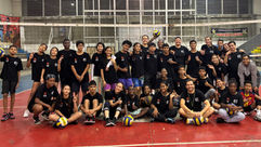 Large group of young volleyball players gathered on a court during a VoleiPaz session in Cali, Colombia