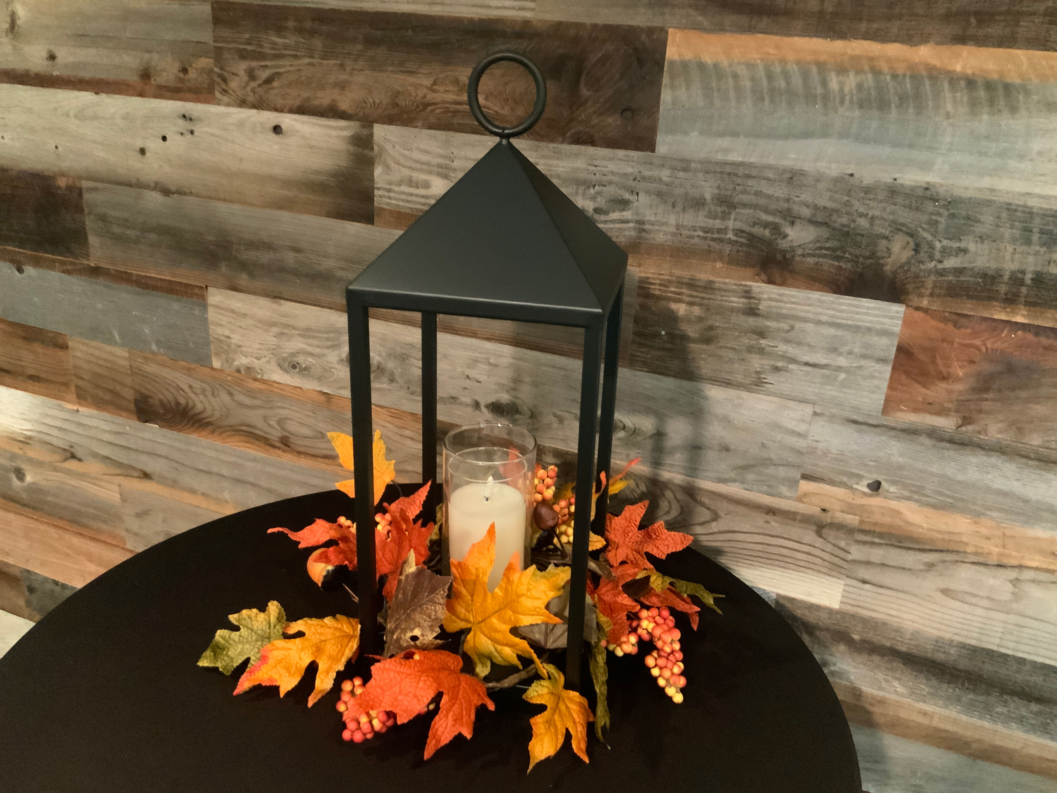 Black metal open lantern w/ Fall leaves and battery flicker candle