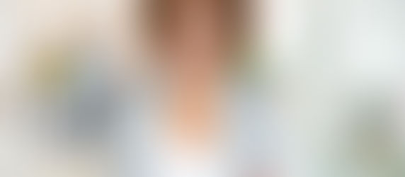 Smiling woman in a brightly lit office