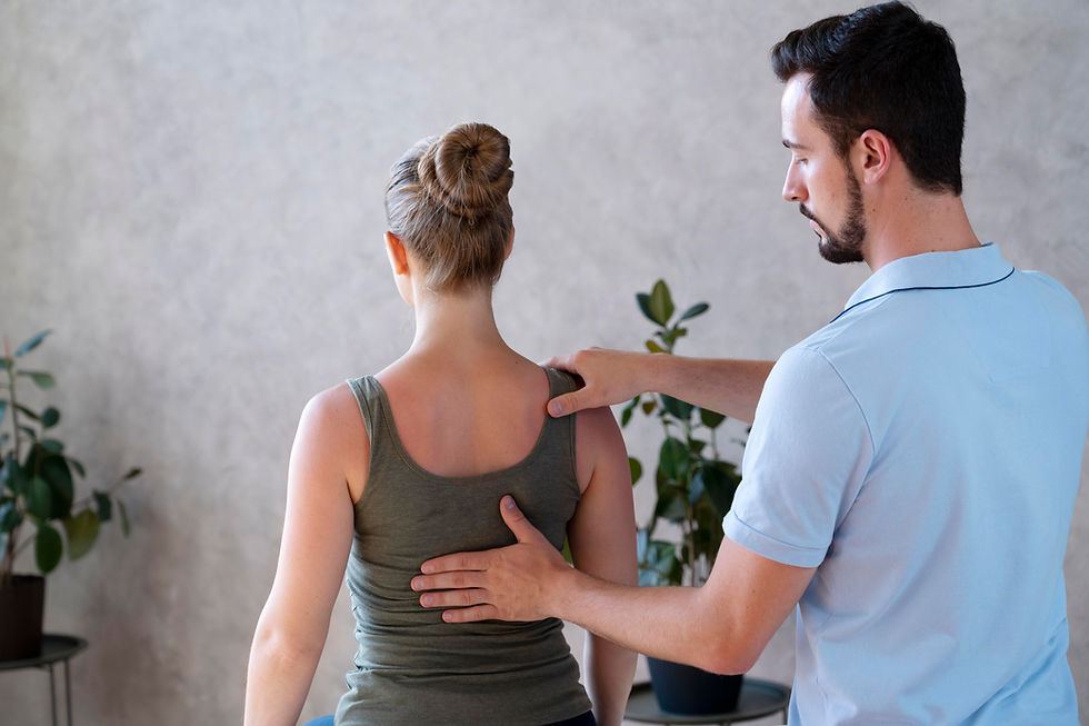 physiotherapist-checking-back-medium-shot.jpg