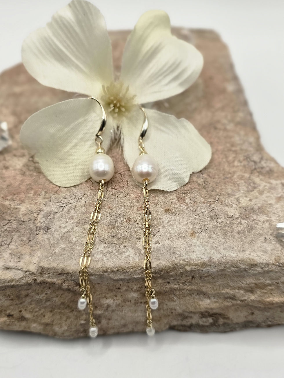 Handmade freshwater pearl drop earrings with cascading gold-filled chains and pearl drops by Kandy By Design