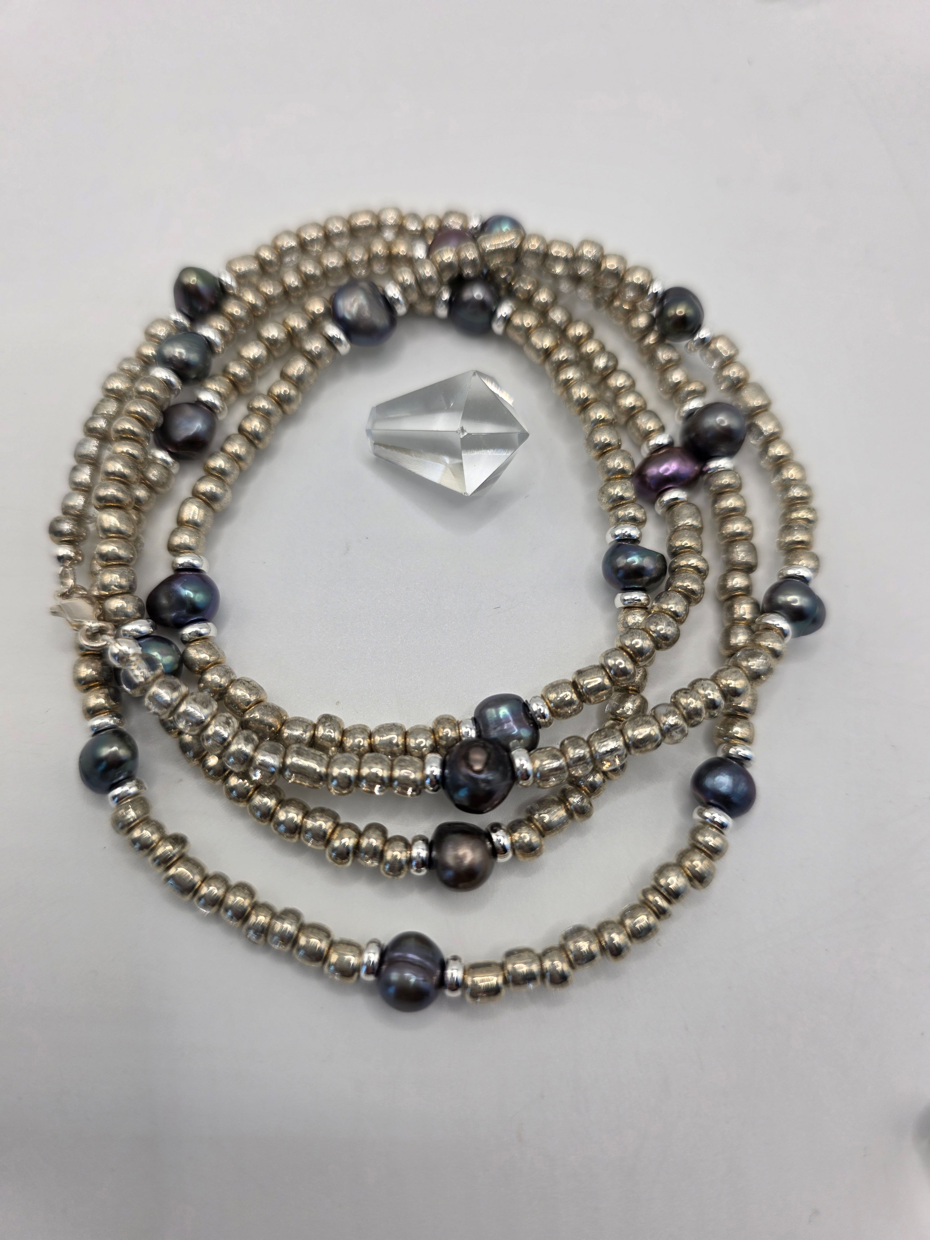 Silver Waters waist bead made with freshwater pearls, sterling‑silver beads, and seed beads.