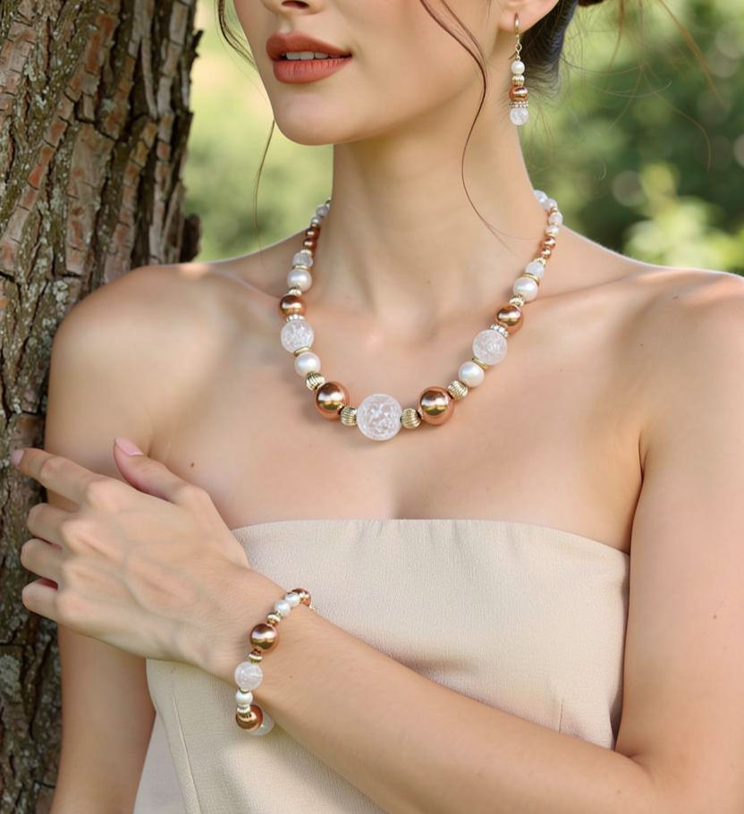 Model is wearing Copper Frost necklace, bracelet, and earrings set