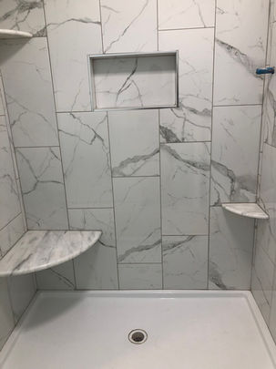 Marble-Tiled Shower and Bathroom