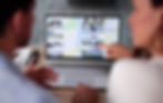 Property owner reviewing an unexpected online real estate listing while monitoring property activity from a home office.