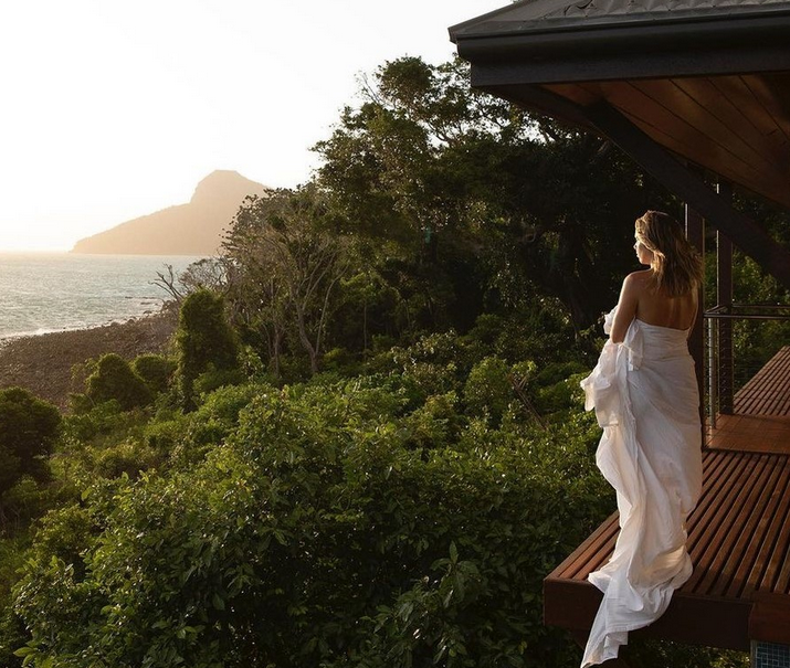 woman looking at over the ocean