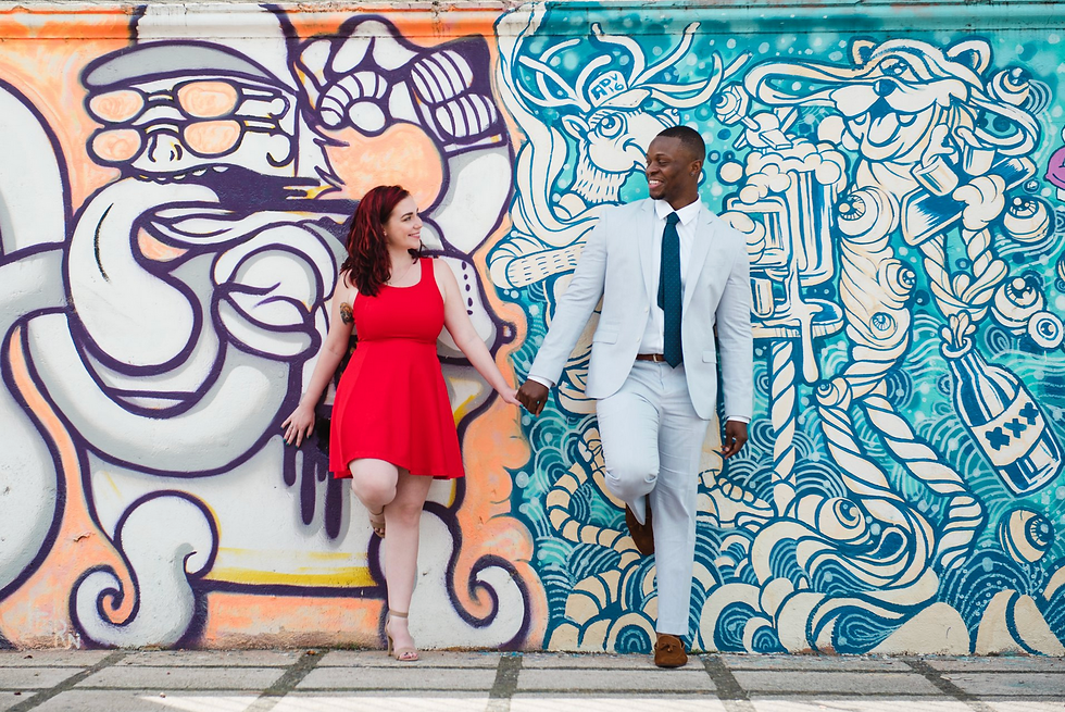 Couple standing in front of a mural in Costa Rica