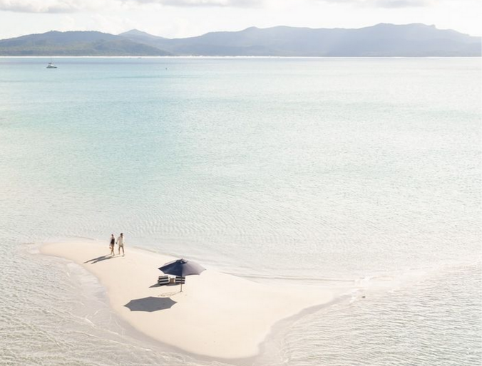 Couple on a sandbar in the Whitsundays
