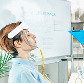 Biofeedback EEG or electroencephalograph training at a health center. Therapist monitoring
