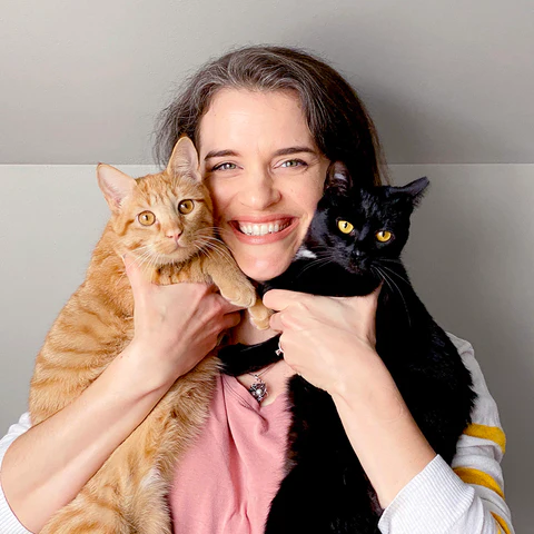 Founder Traci holding Chester and Pearl