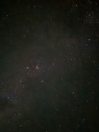 Wide shot of starry night sky showing deep space constellations in black sky