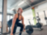 Female athlete doing deadlifts
