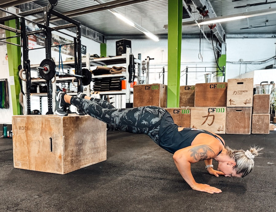 Athlete doing push-ups on a plyo box