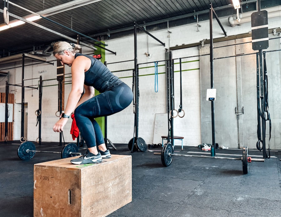 Female athlete performing box jumps