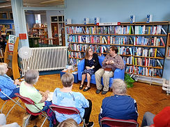 Charles Heathcote and Margaret Holbrook on the blue sofa at Reddish library, June 2025
