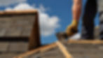 roofer-nailing-down-shingles-steep-roof.jpg