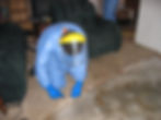 Christian Cadieux uses a carpet knife to capture medical waste from an unattended death (decomposition).