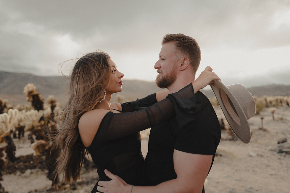 Couple embracing in a desert landscape