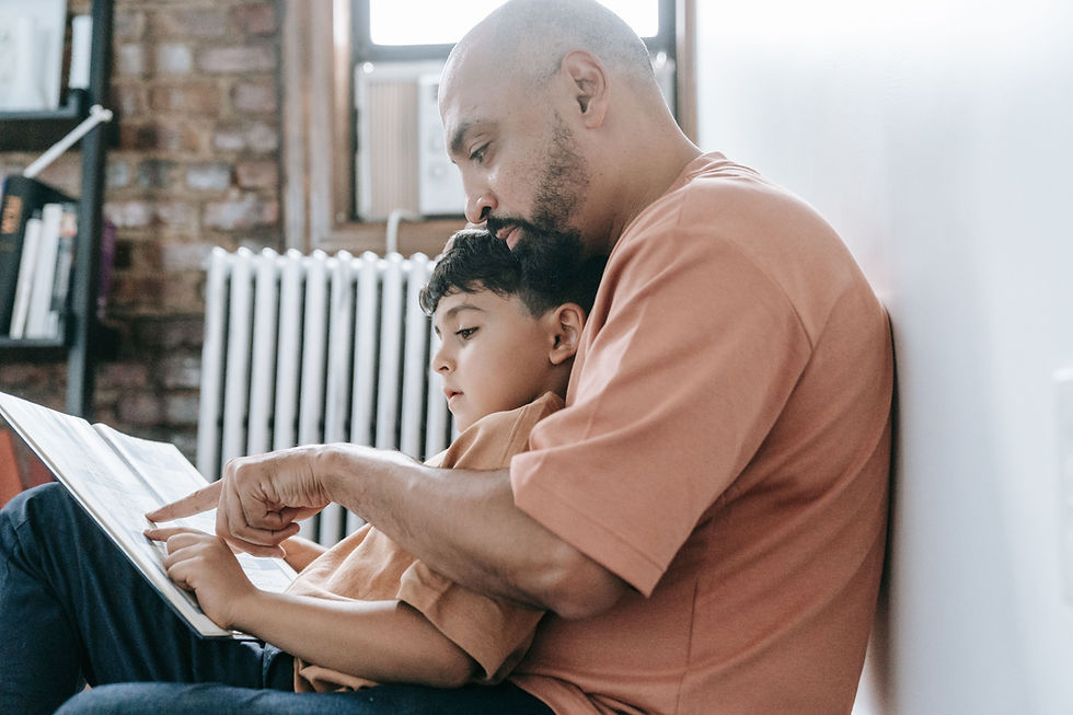 A father and son reading together