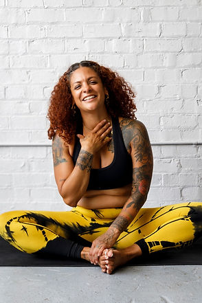 woman smiling practicing yoga