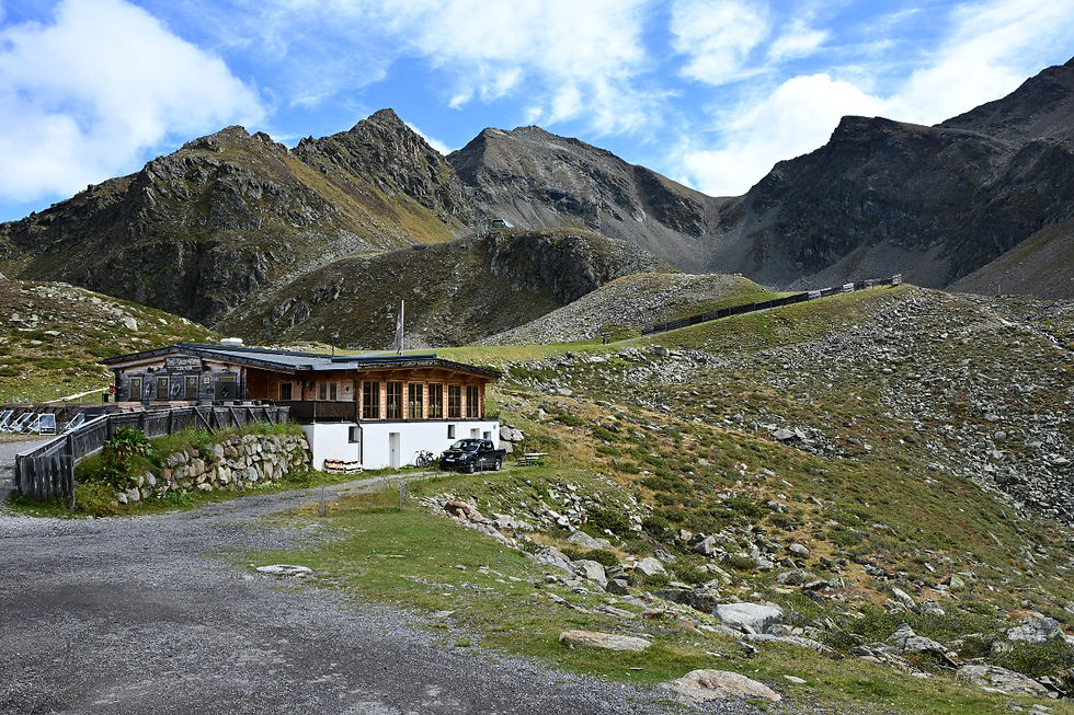 Hut in front of a mountain backdrop in Tyrol