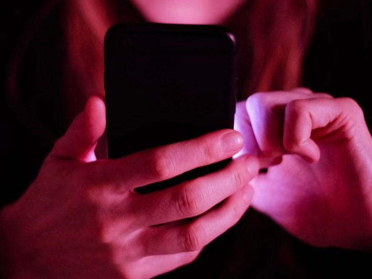 girl scrolling on phone
