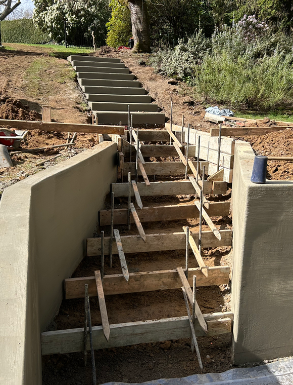 Retaining wall installed and forms for stairs are installed in Portland, Oregon