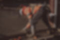 concrete contractor with safety clothes and rubber boots finishing a concrete slab