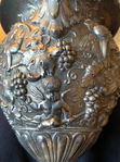 <img src="Clodion Claude Michel.jpg" alt="A splendid urn featuring relief body with cupids amidst grape clusters">