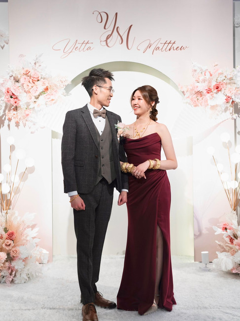 rela bride Yetta wearing a crimson red dress