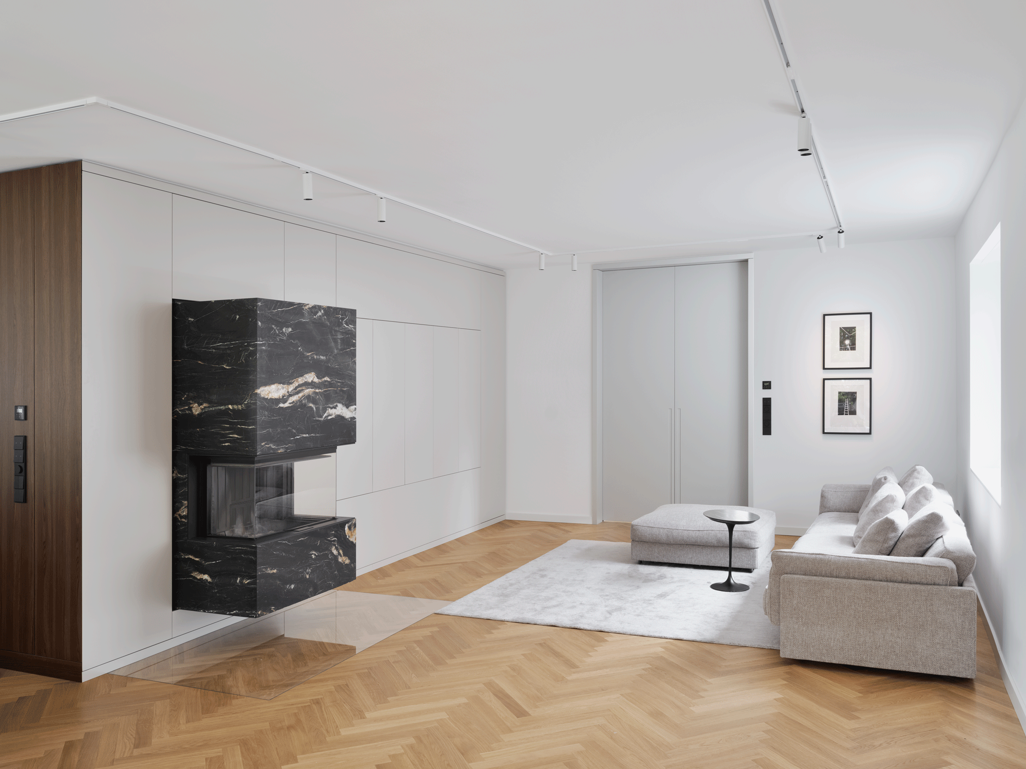 Living room overview in private residence, Berlin — modular storage system with opening doors and view into hallway